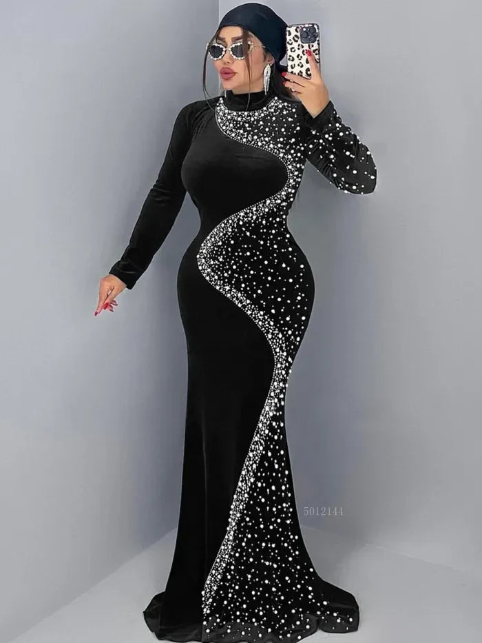 Elegant black long dress with asymmetrical crystal embellishments and long sleeves