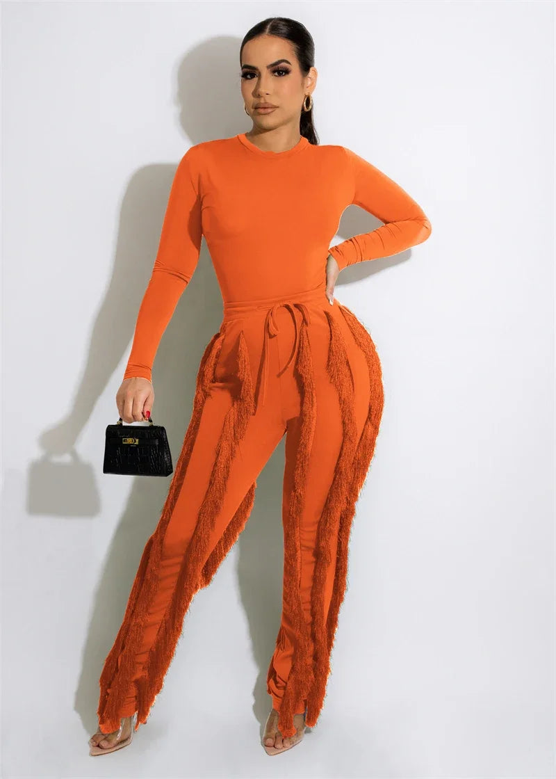 Elegant women's 2-piece fall winter outfit with long sleeve bodysuit top and tassel pants by JN Fashion Fusion.