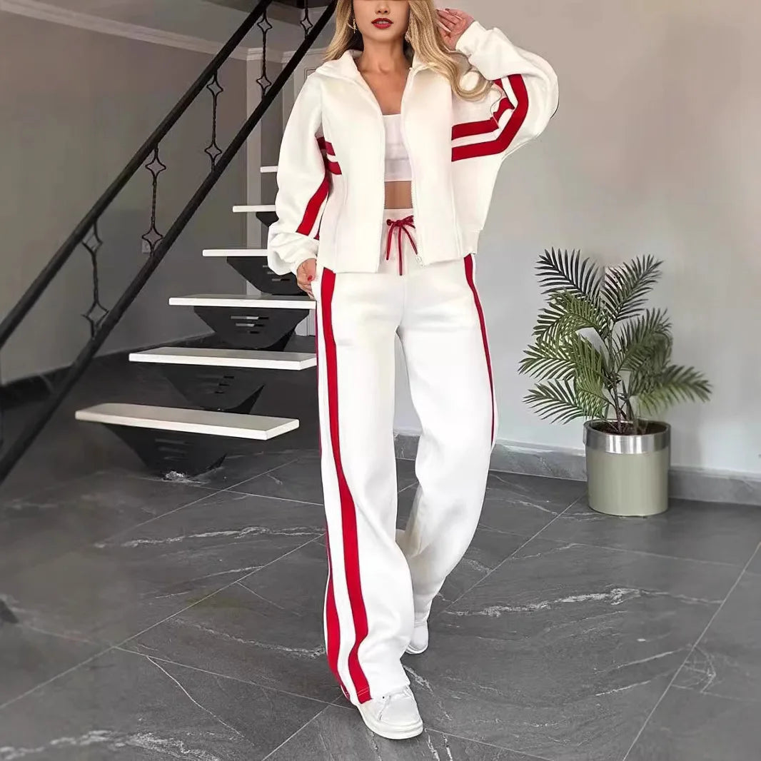 Ladies stripe tracksuit set by JN Fashion Fusion featuring a zip-up crop jacket and high-waist wide-leg sweatpants.