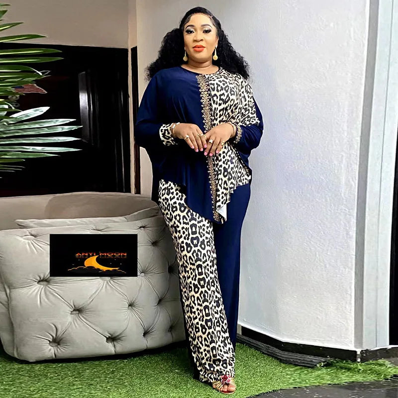 African fashion two-piece set for women featuring leopard print patchwork, batwing sleeves, loose top and matching pants by JN Fashion Fusion.