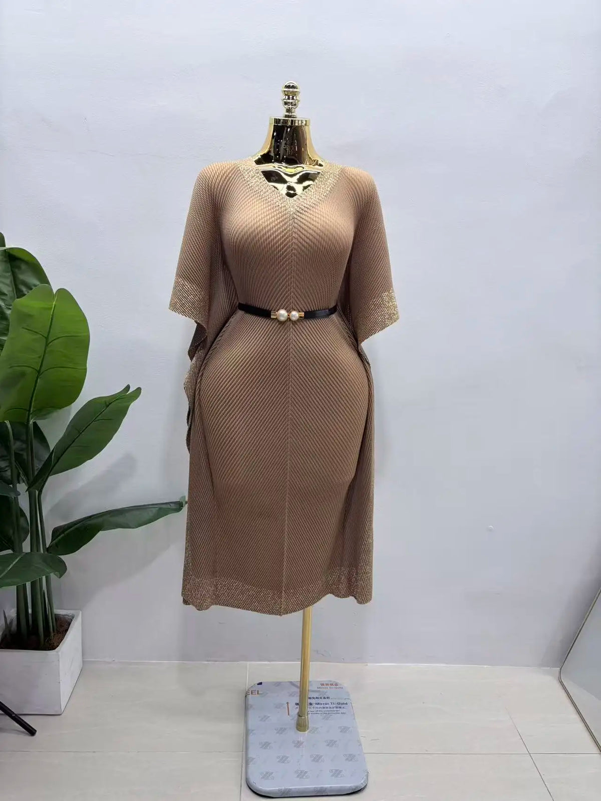 Africa-inspired V-neck bat sleeve long dress by JN Fashion Fusion featuring bronzing dragon scale pattern and pleated fringe details.