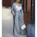 Women’s wide-leg pants suit by JN Fashion Fusion with striped jacket and floor-length trousers, casual autumn 2-piece ensemble.