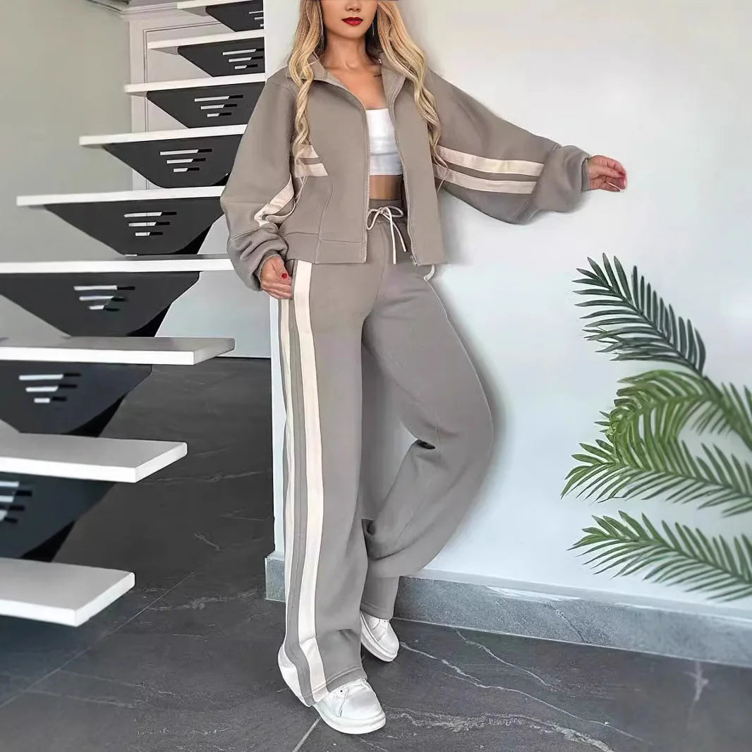 Ladies stripe tracksuit set by JN Fashion Fusion featuring a zip-up crop jacket and high-waist wide-leg sweatpants.