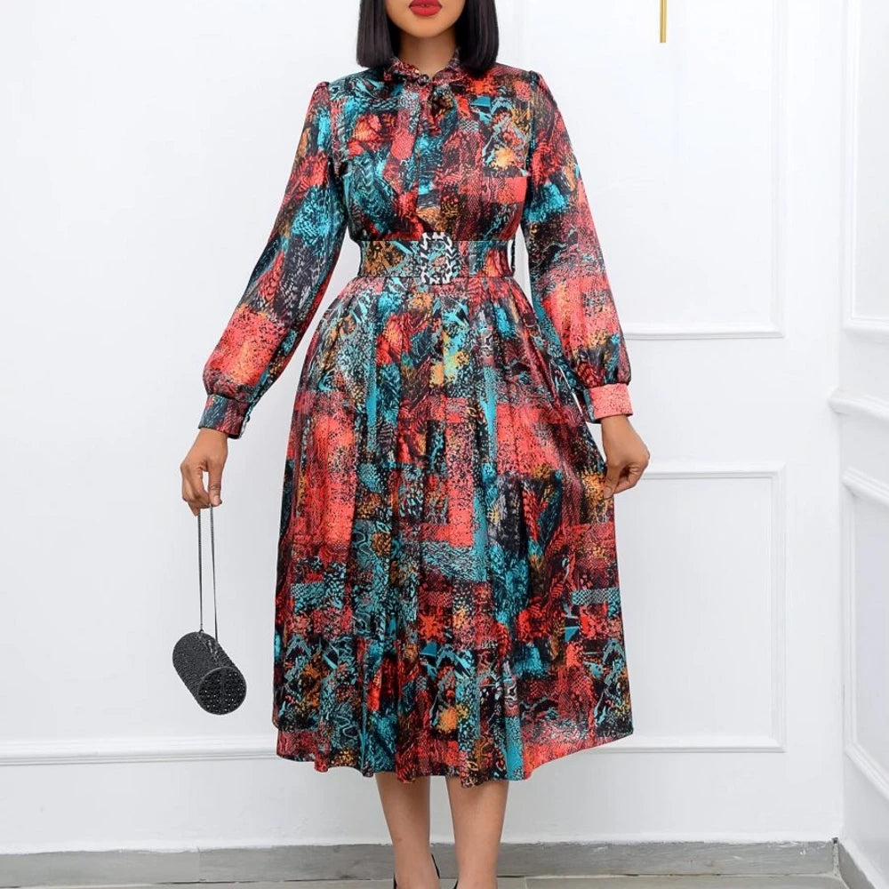 Elegant African women's dress by JN Fashion Fusion featuring a dashiki-inspired pleated design, perfect for spring and summer events.