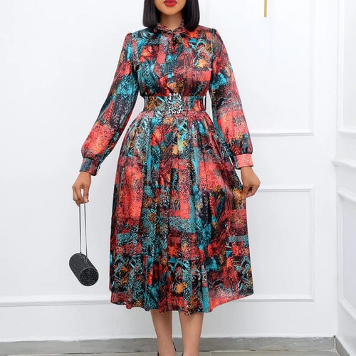 Elegant African women's dress by JN Fashion Fusion featuring a dashiki-inspired pleated design, perfect for spring and summer events.