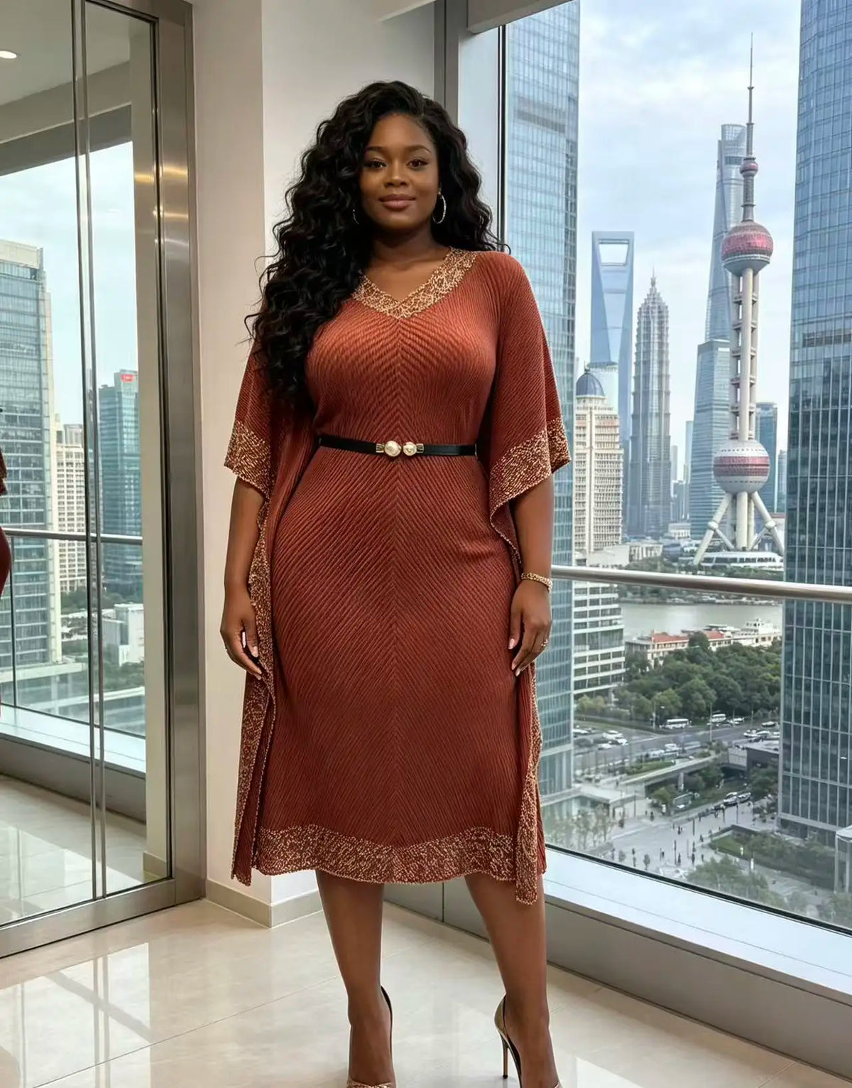 Africa New V-neck bat sleeve long dress by JN Fashion Fusion with dragon scale pleats, fringe details, and bronzing accents.