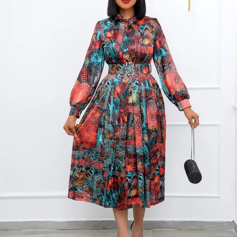 Elegant African dress for women featuring a dashiki-inspired design, pleated details, and a midi length for spring and summer wear.