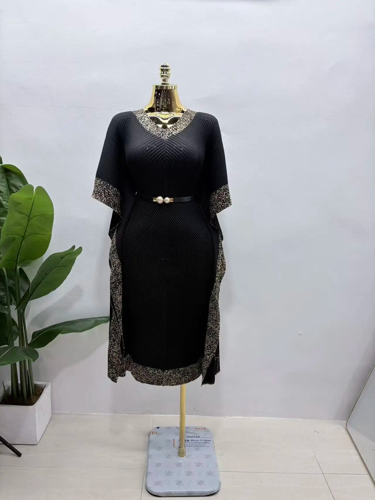 Africa New V-neck bat sleeve long dress by JN Fashion Fusion featuring dragon scale pattern, pleats, fringe, and bronzing details.